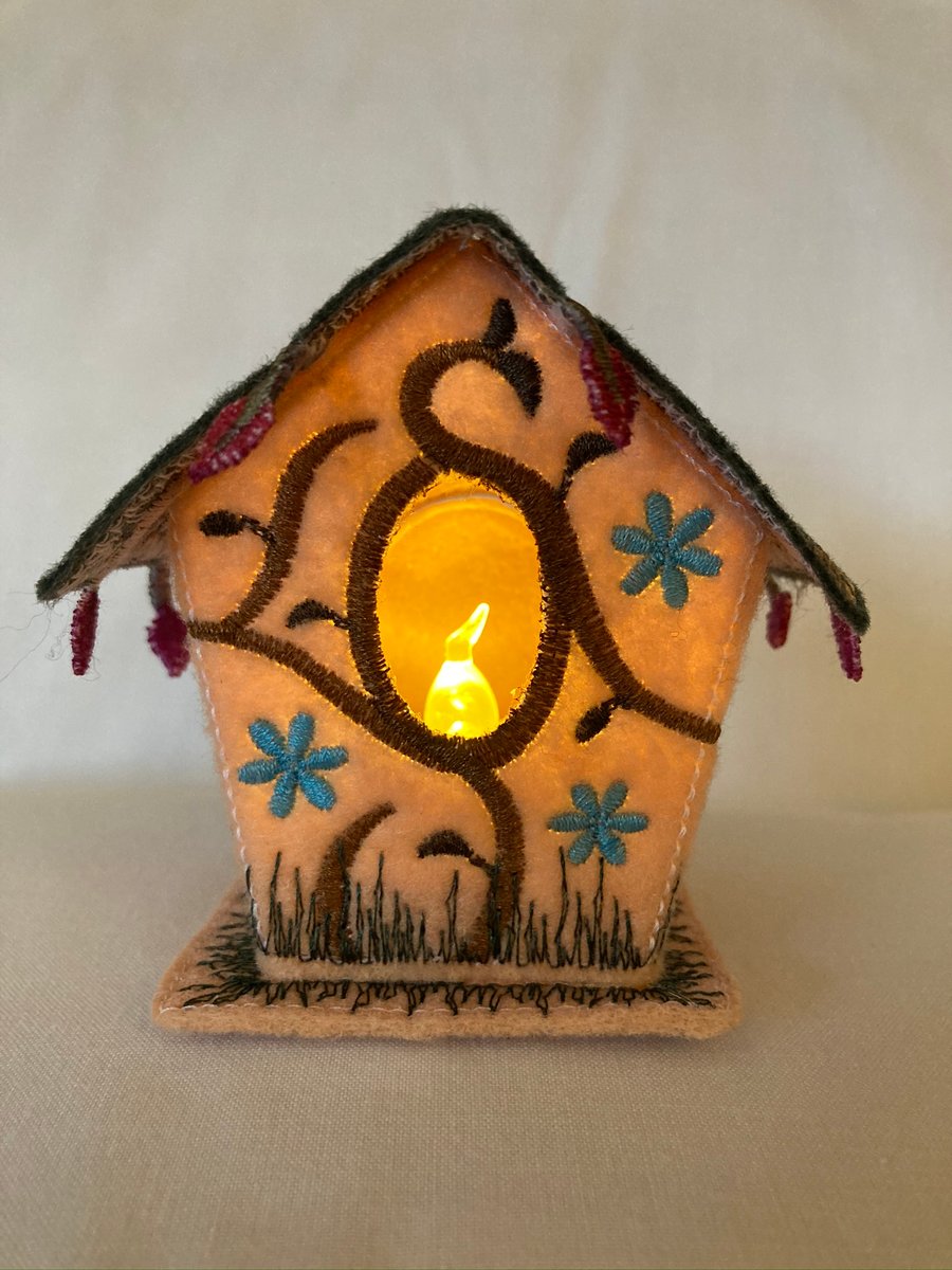 Little felt fabric embroidered tea light bird house. 