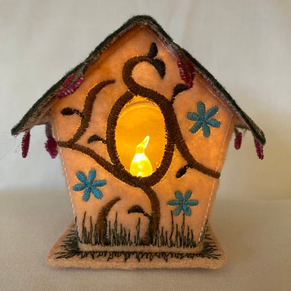 Little felt fabric embroidered tea light bird house. 
