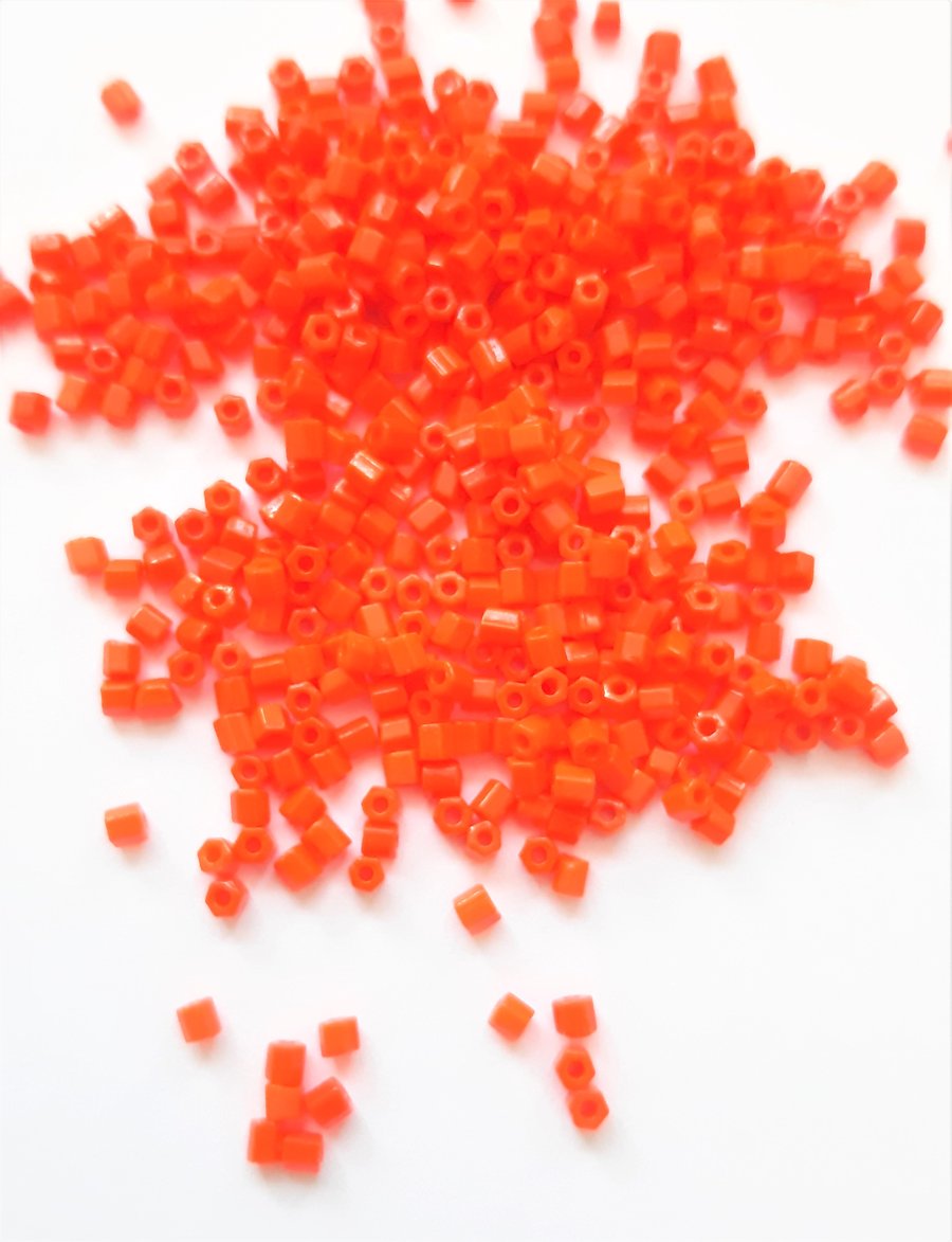 Orange Hexagon beads, size 11.