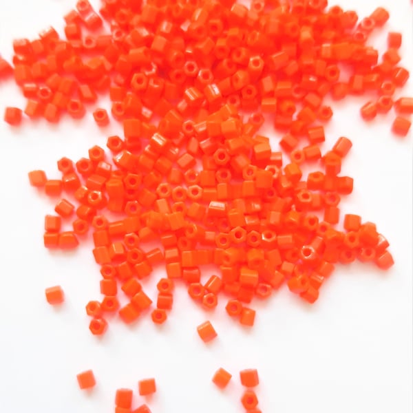 Orange Hexagon beads, size 11.