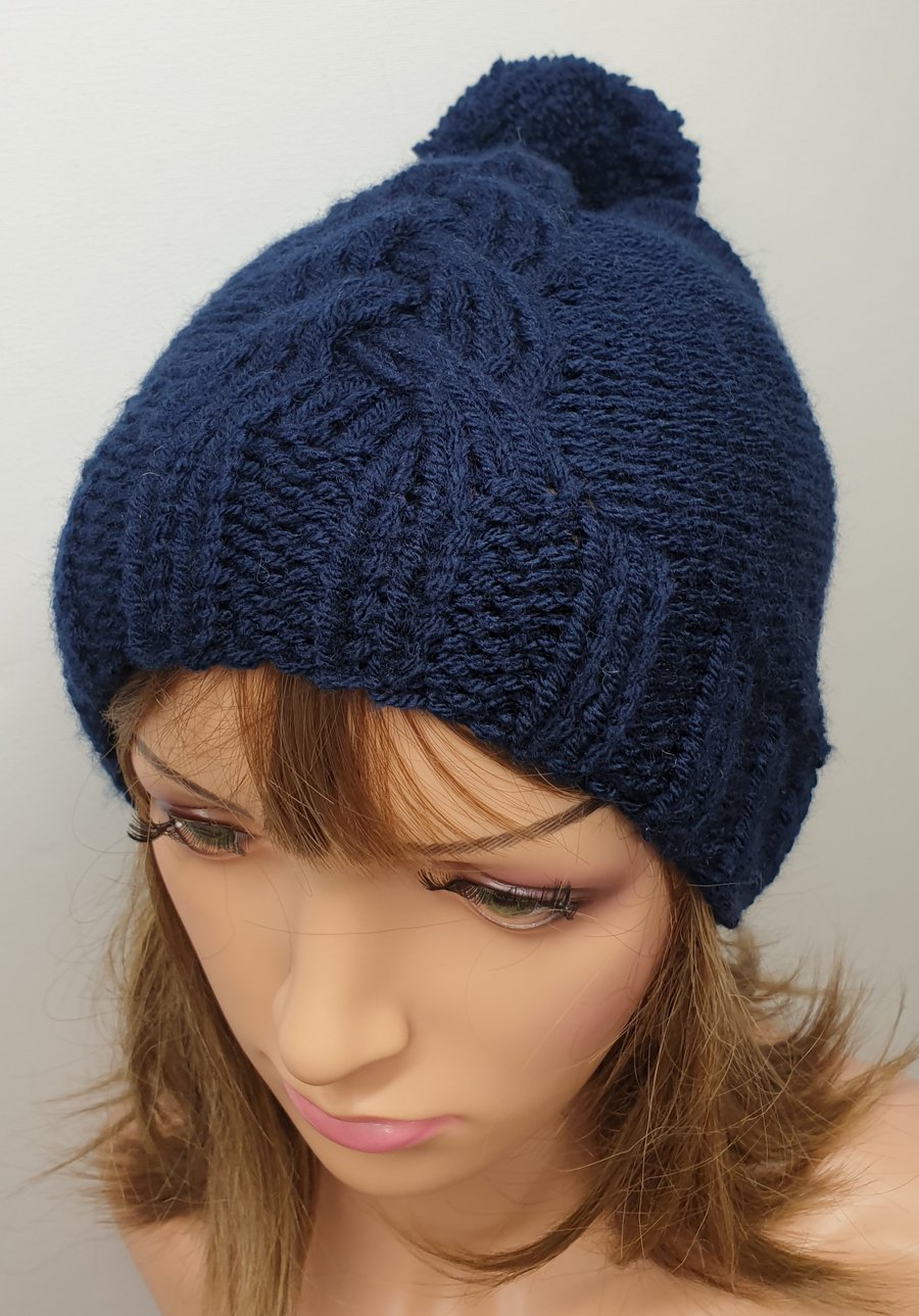 Hand knitted navy blue pompom hat