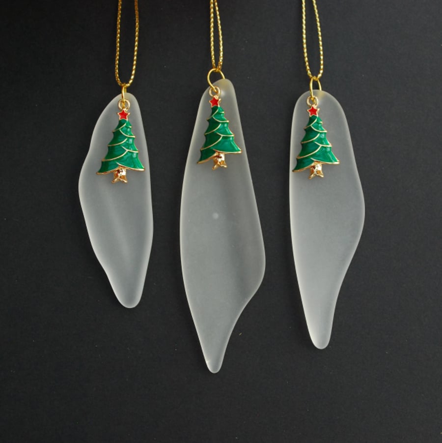 White glass icicles with Christmas trees 
