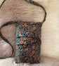 Floral needlecord crossbody bag.