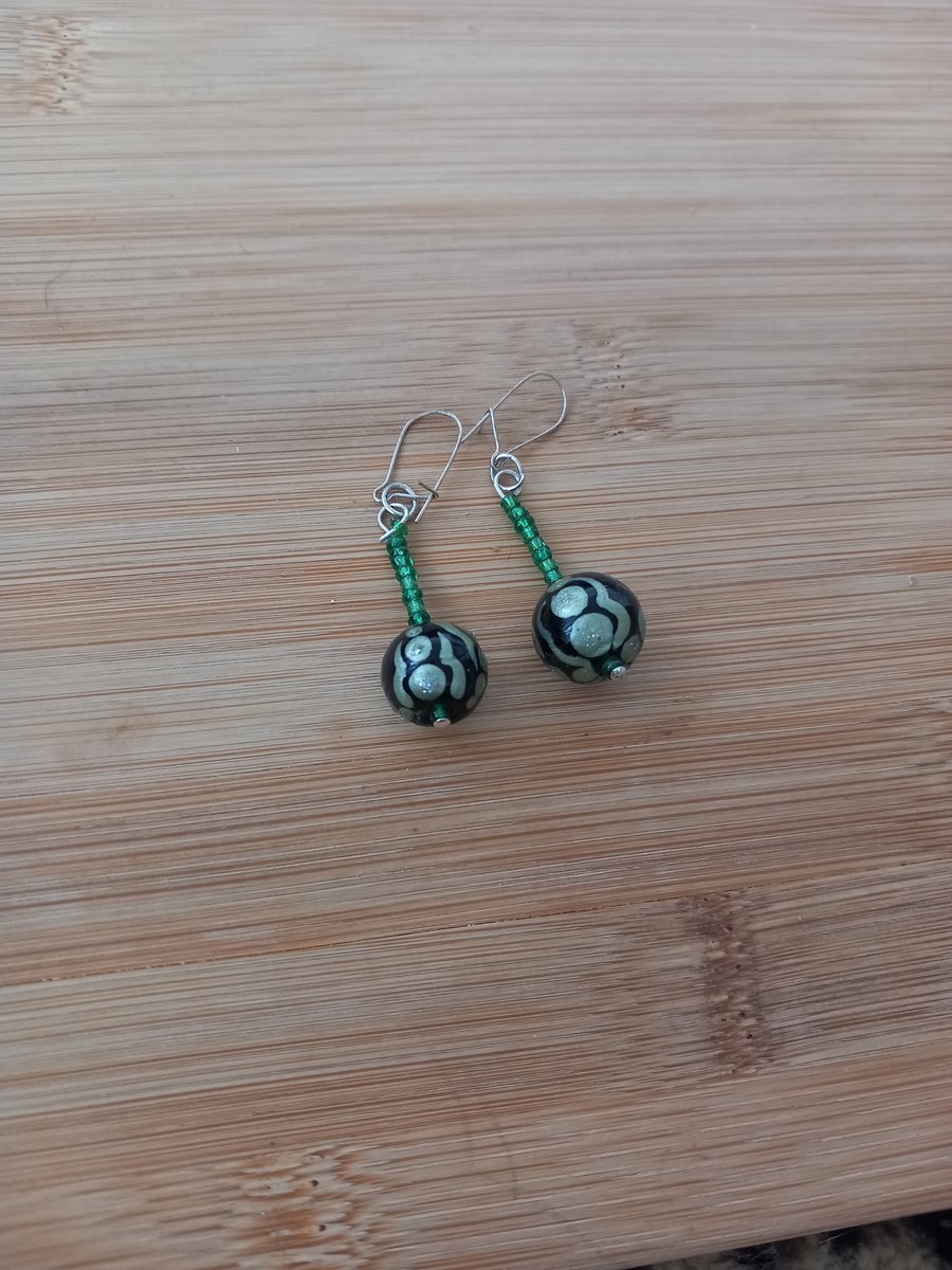 Green and black beaded earrings for pierced ears