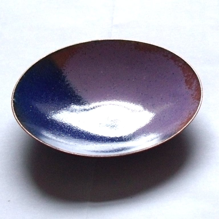 enamel bowl: dark blue, dark pink, copper tones