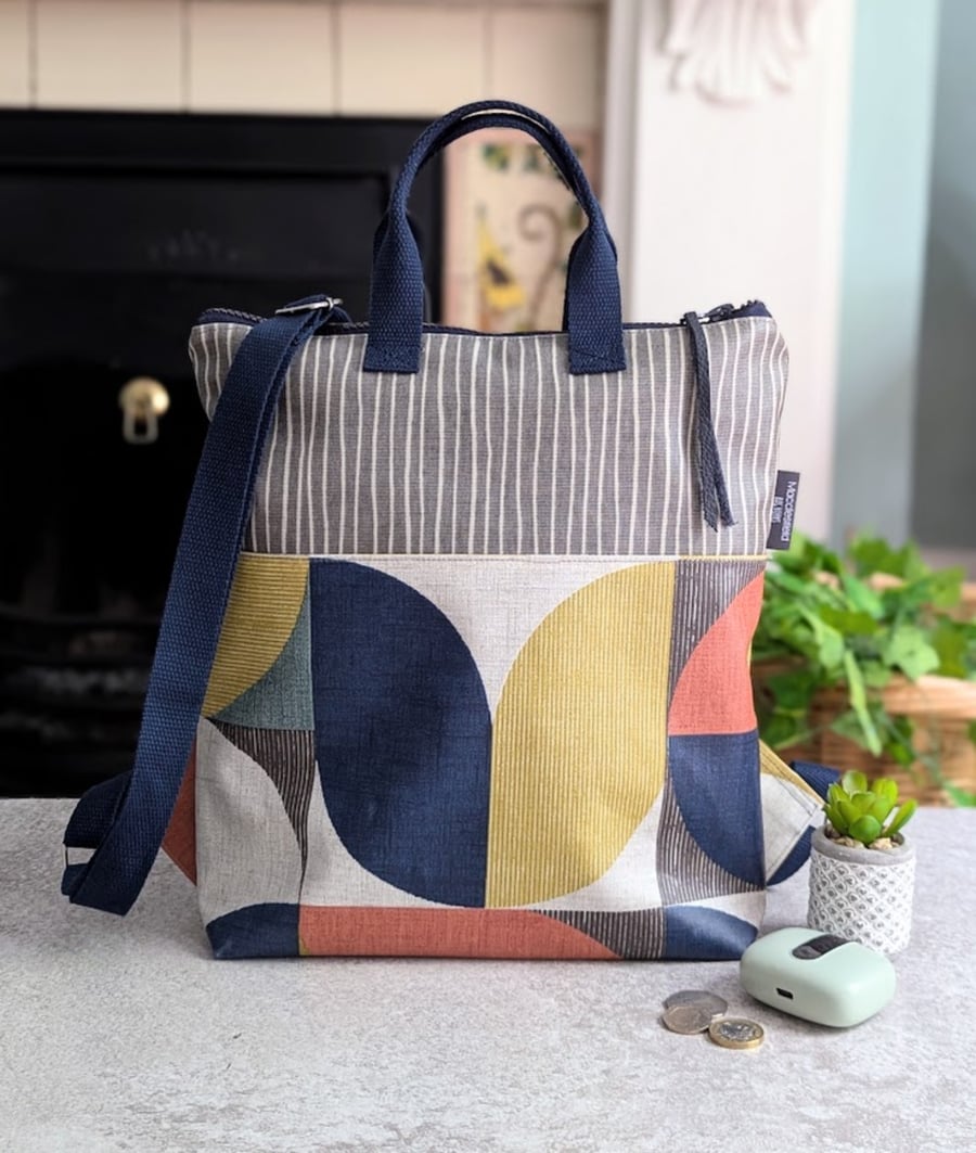 Geometric Print Compact Medium Warm Tones Backpack with Navy Straps