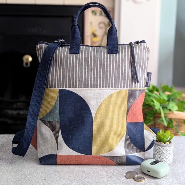 Geometric Print Compact Medium Warm Tones Backpack with Navy Straps