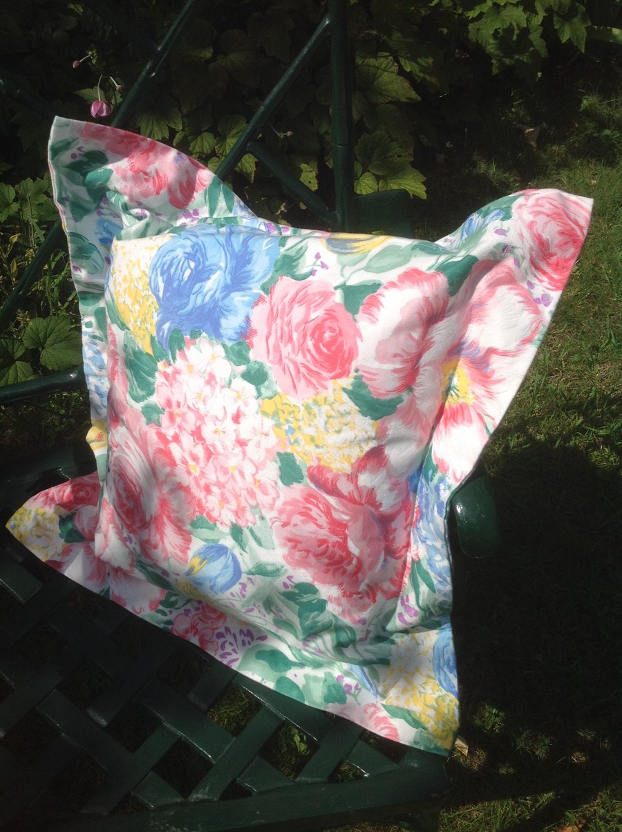 Pink, blue and yellow floral cushion