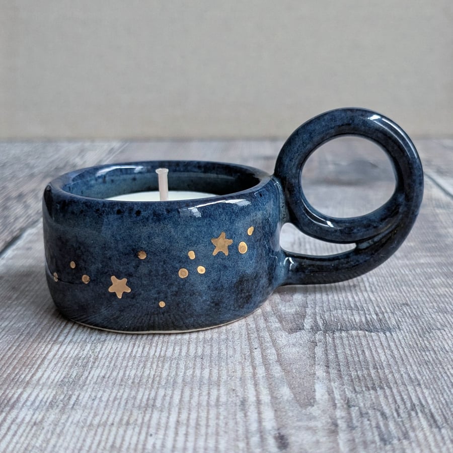 Very dark blue ceramic tealight holder with gold stars
