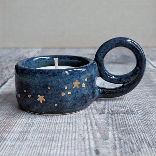 Very dark blue ceramic tealight holder with gold stars