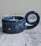 Very dark blue ceramic tealight holder with gold stars
