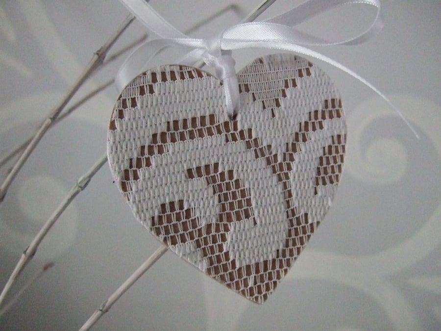 Decoration - snowy white lace on birch wood heart