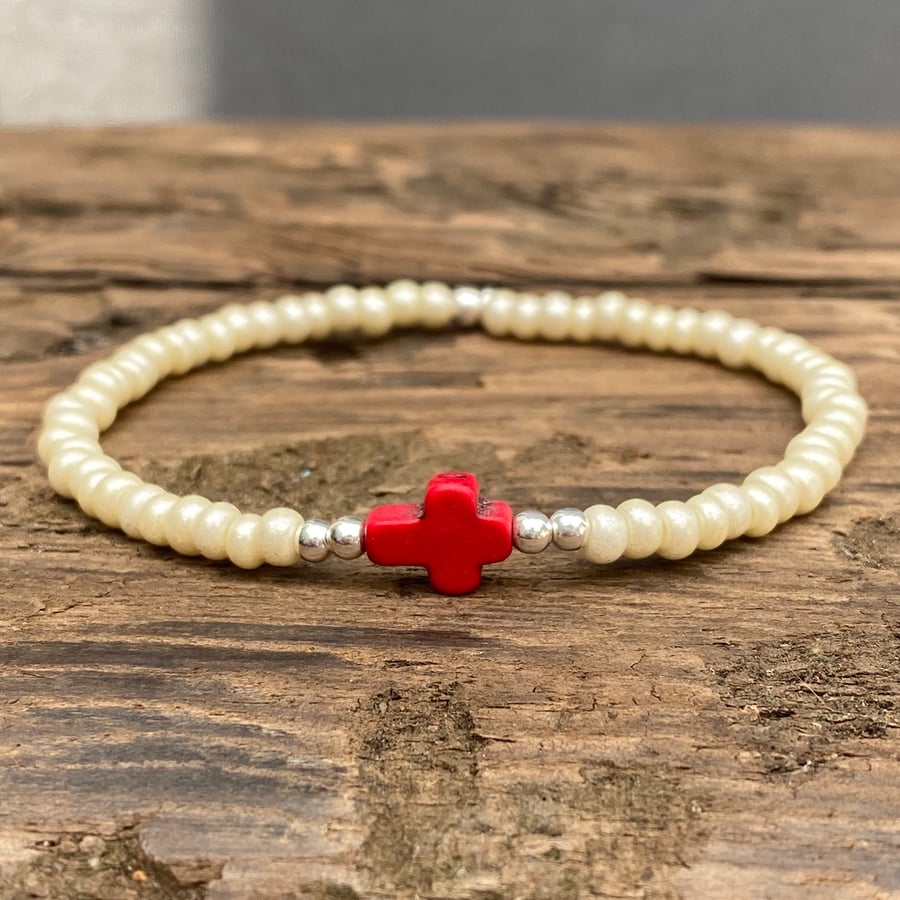 Red howlite cross and cream seed bead bracelet 