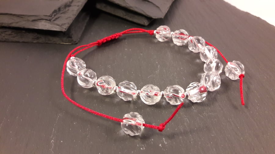 Clear Quartz Carved Roses on Red Cord Adjustable Bracelet