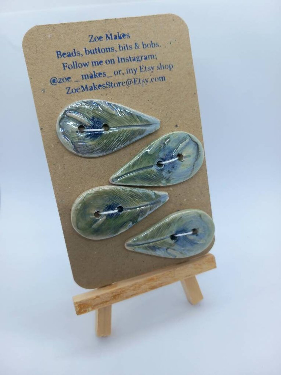 Green blue peacock feather handmade ceramic buttons. Embossed design, handpainte