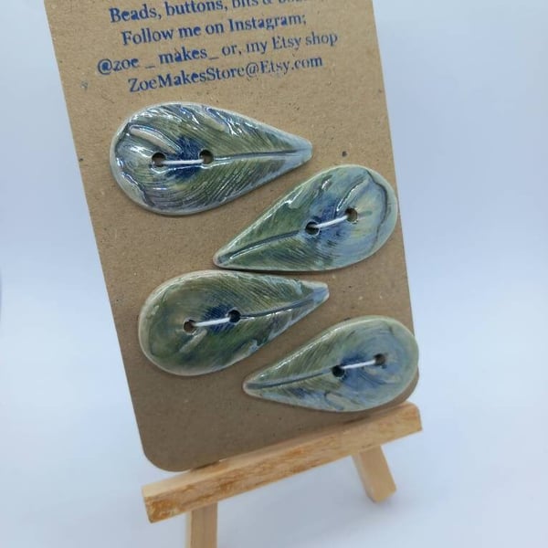 Green blue peacock feather handmade ceramic buttons. Embossed design, handpainte