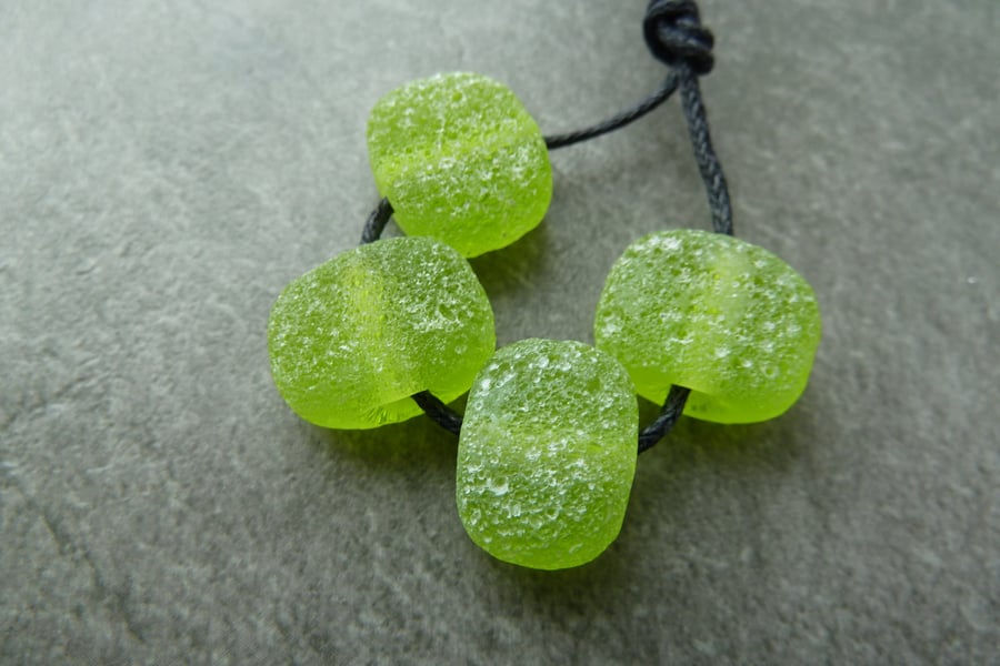 green pitted lampwork glass beads
