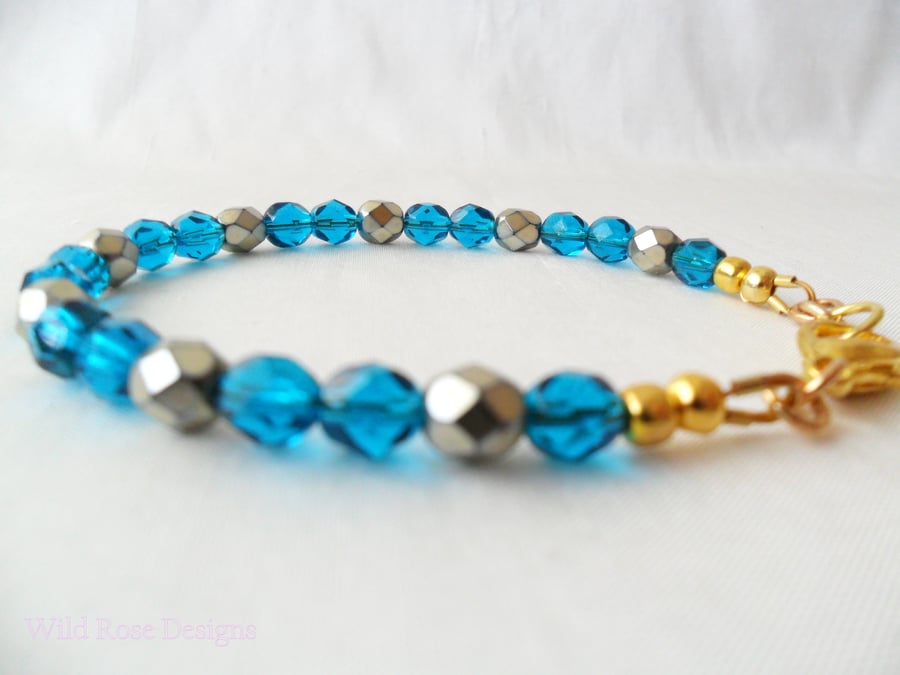Teal and gold bead bracelet