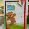 Cute teddy bear flying a kite birthday card