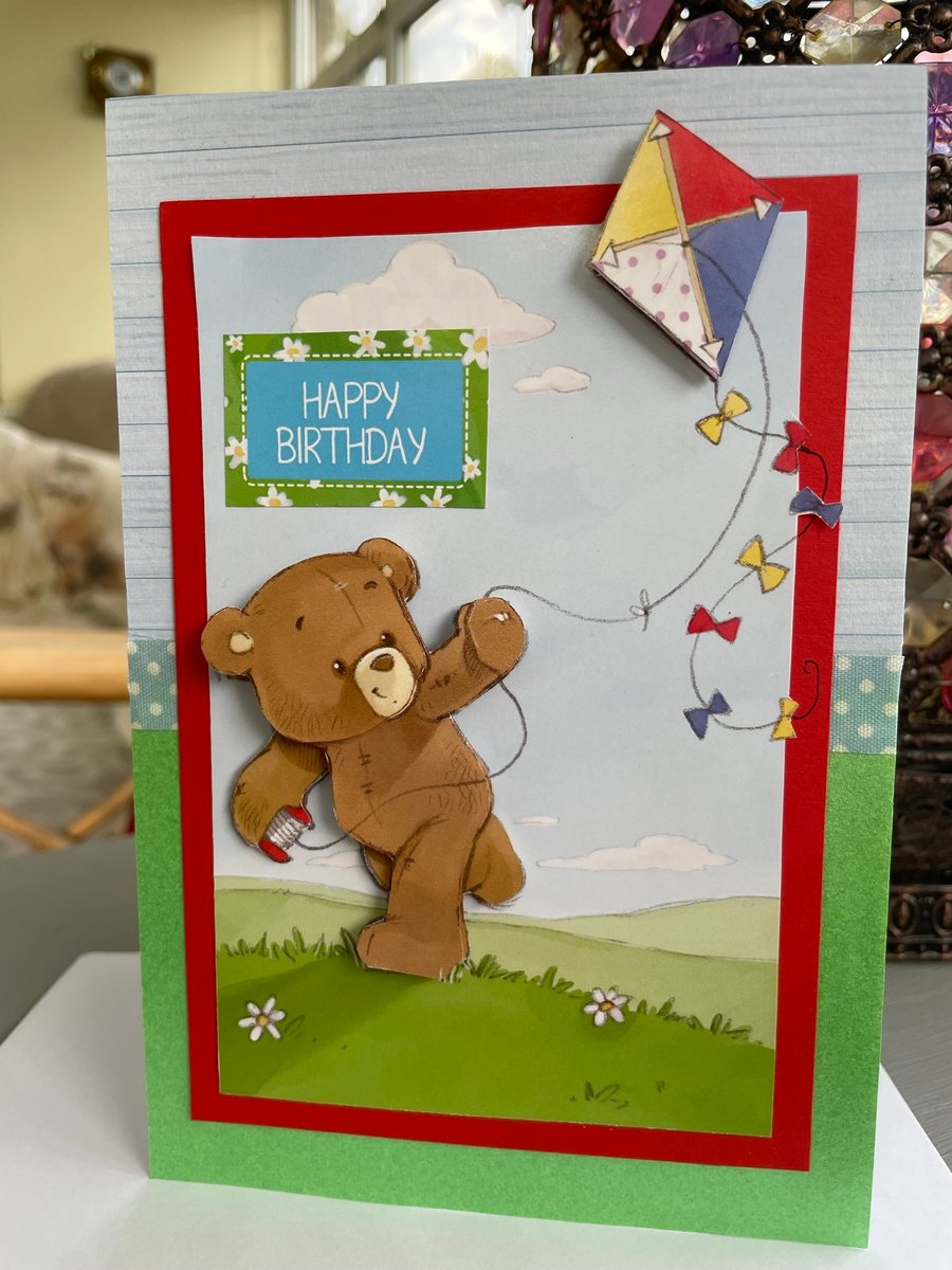 Cute teddy bear flying a kite birthday card