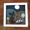 Upcycled Leaping hare landscape. Handstitched onto fabric pieces.