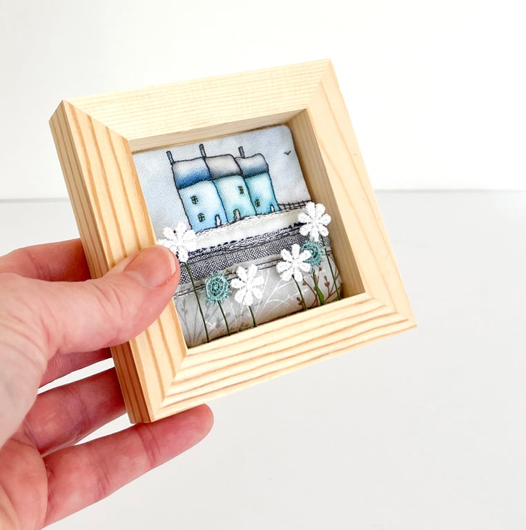 Winter houses, little fabric houses in a small wooden frame