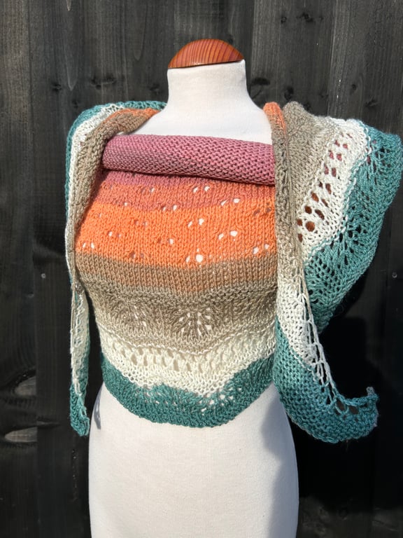 Unique hand knitted extremely shallow crescent wrap scarf in soft wool yarn cake