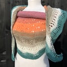 Unique hand knitted extremely shallow crescent wrap scarf in soft wool yarn cake