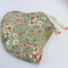 Medium reusable double layered, washable and adjustable floral face mask