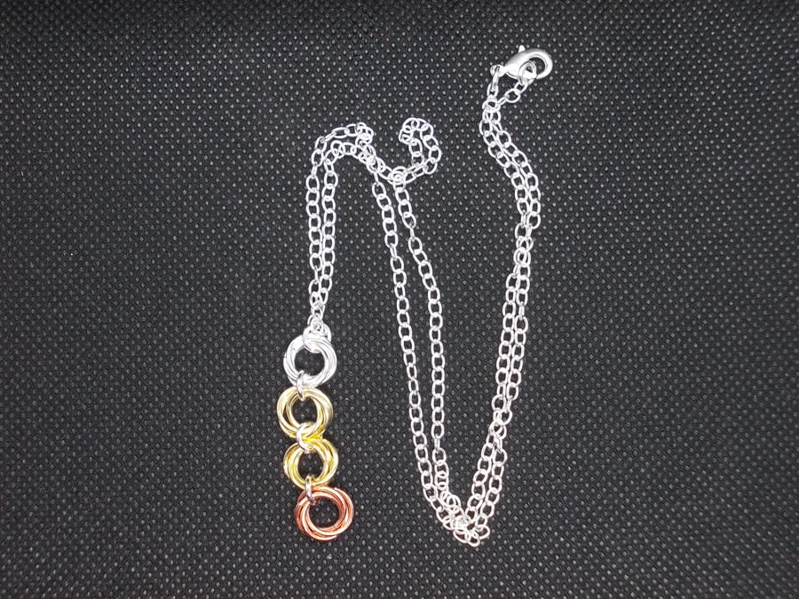 SALE - 4 ring mobius pendant on chain