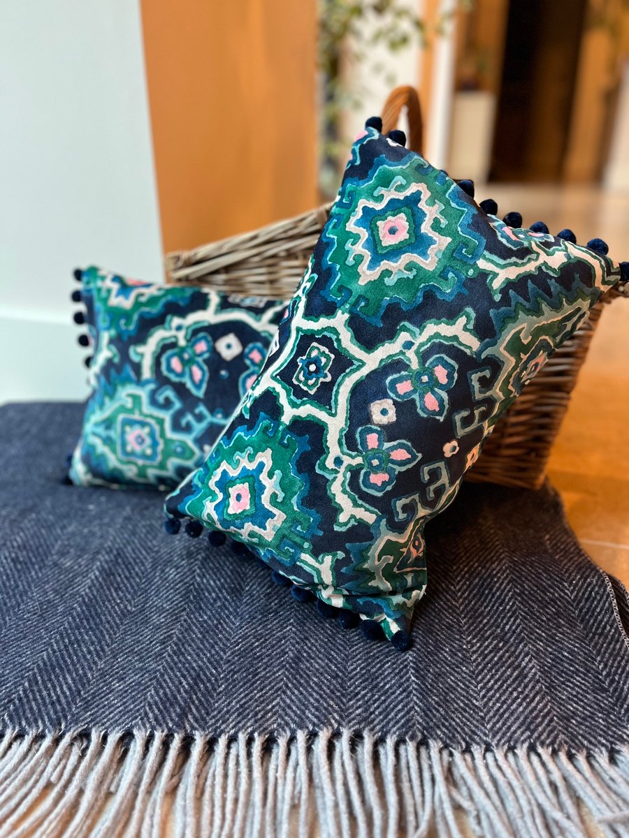 Blue and green velvet cushion with pompoms colourful home