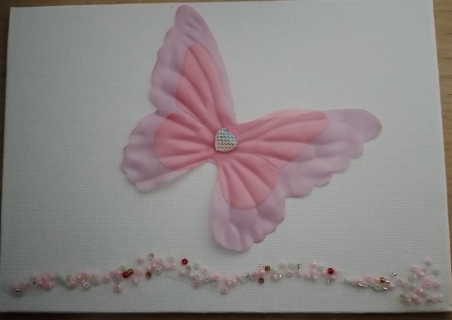 Small butterfly and bead picture on canvas