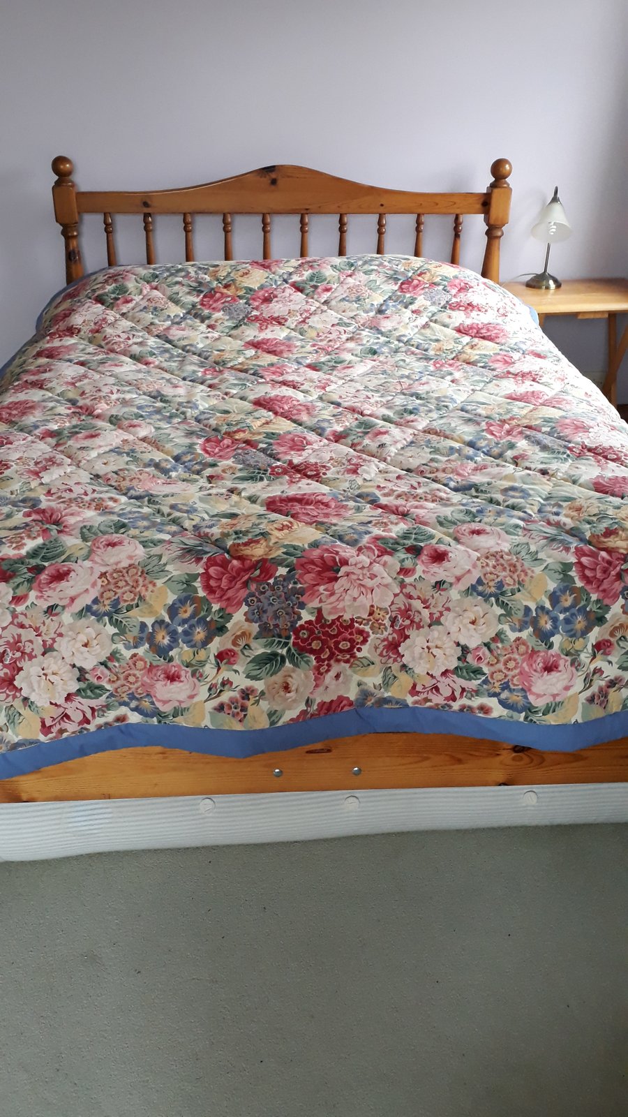 Quilt in Sanderson rose and peony fabric, hand quilted