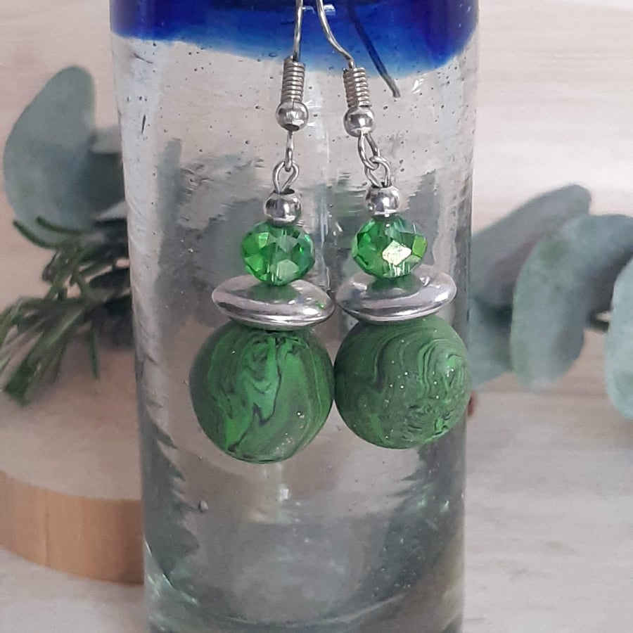Green, black and silver dangly earrings