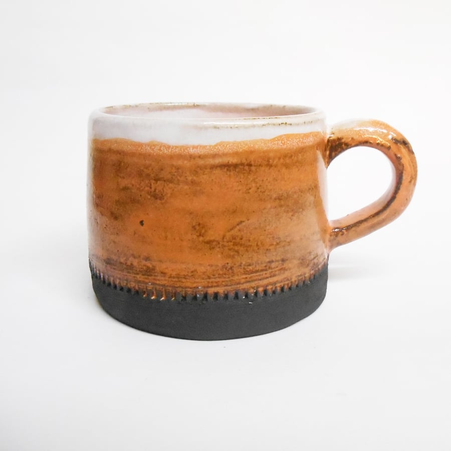 Mug Black clay Orange glazed Textured Stoneware Ceramic.