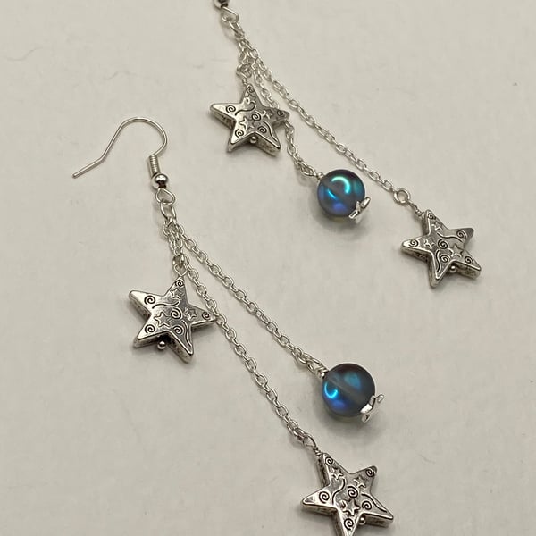 Silver tone star charm drop earrings with mystic quartz
