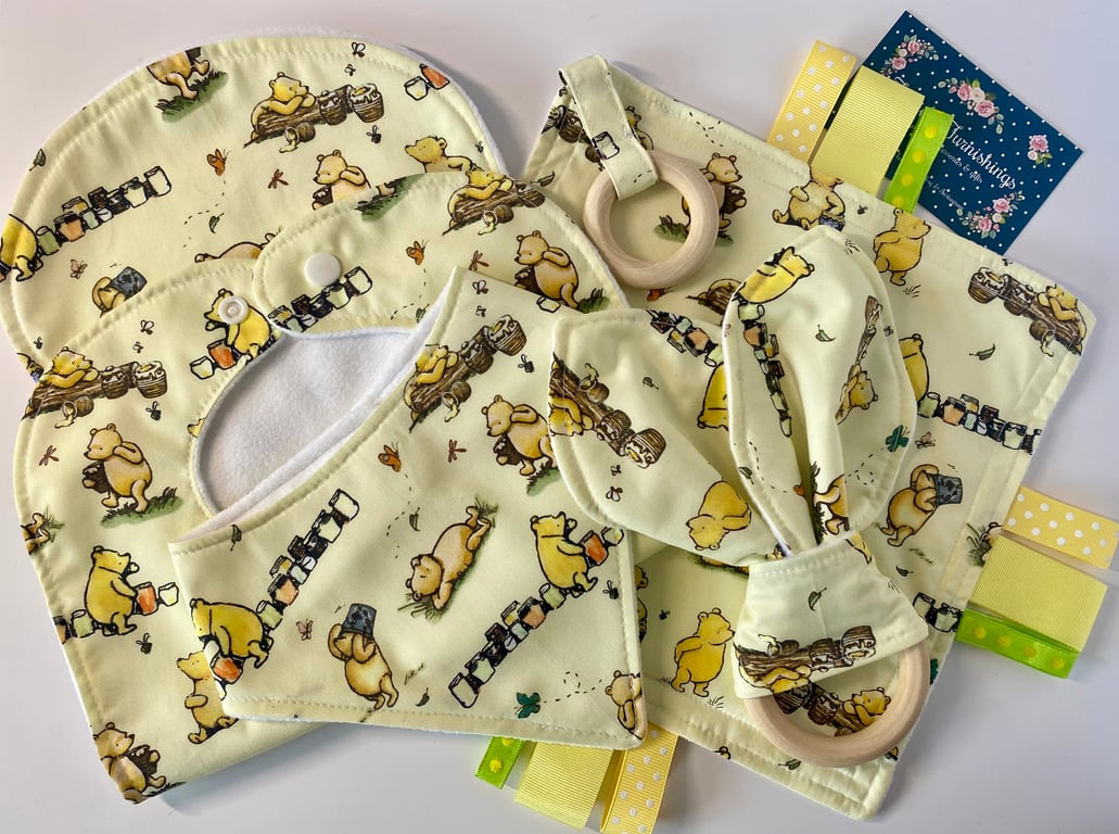 Five piece baby set - two bibs, shaped burp cloth, tag toy & teether - Pooh