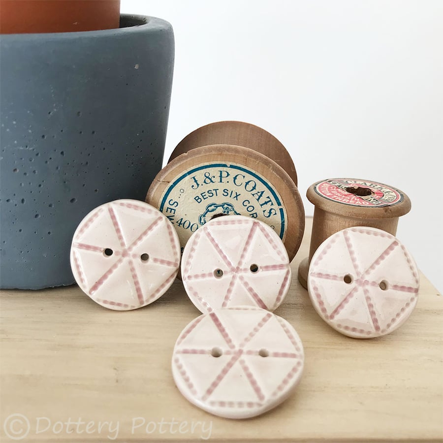 Set of four pale pink ceramic handmade buttons