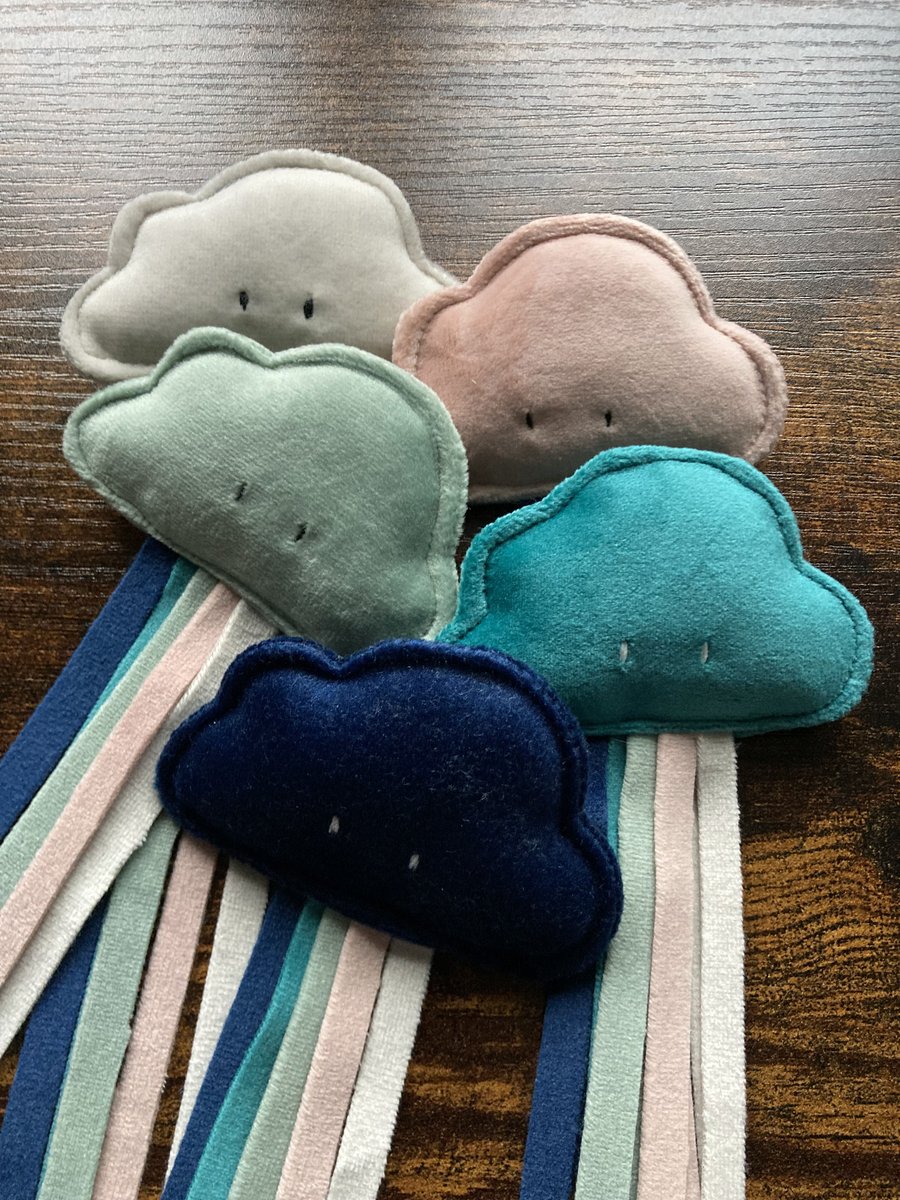Velvet Cloud Cat toy with raindrop strips.