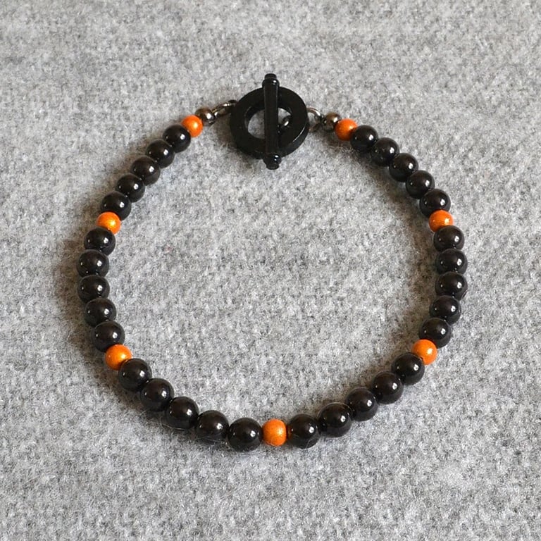 Black Glass and Orange Miracle Bead Bracelet