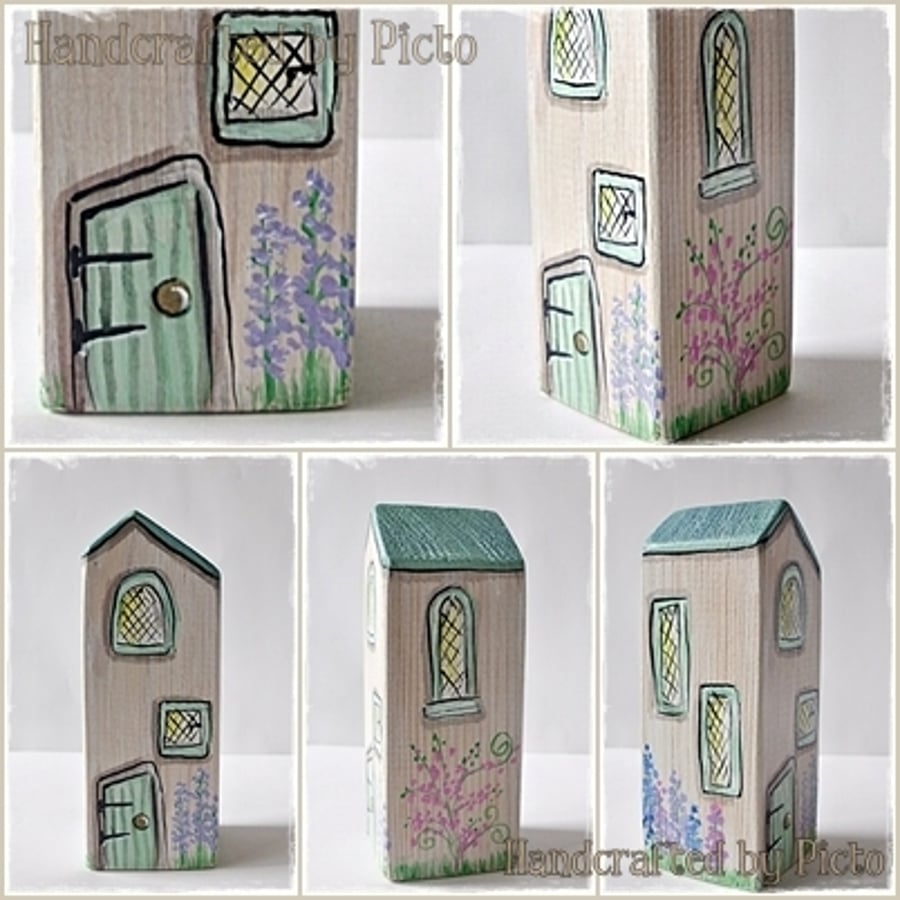 Little Green Cottage where Flowers Bloom in the Garden