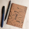 Hand drawn A6 notebook with tree design and blank plain pages