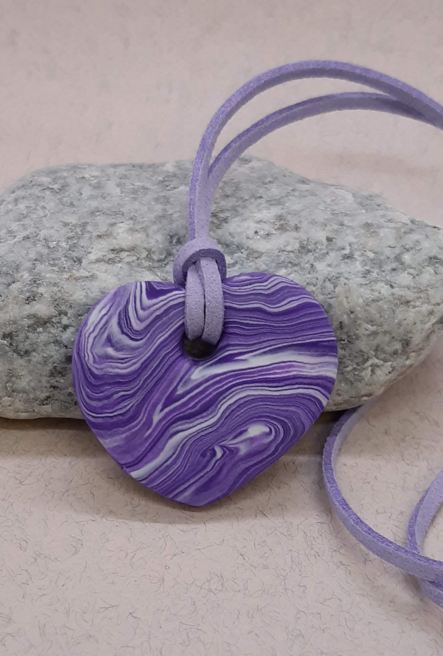 Purple and white heart shaped polymer clay pendant