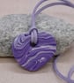 Purple and white heart shaped polymer clay pendant