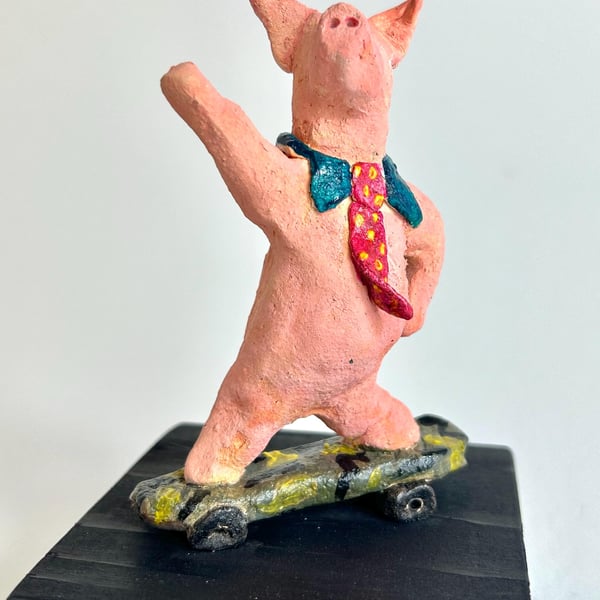 Hand-Built Ceramic Skateboard Pig Sculpture on Wood Block
