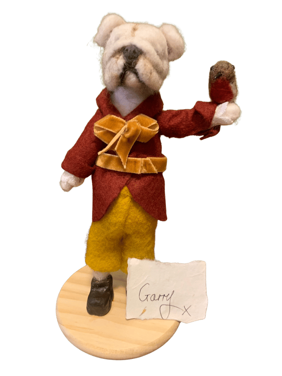 Meet Garry, a dapper bulldog in a russet wool coat and Bob the Robin