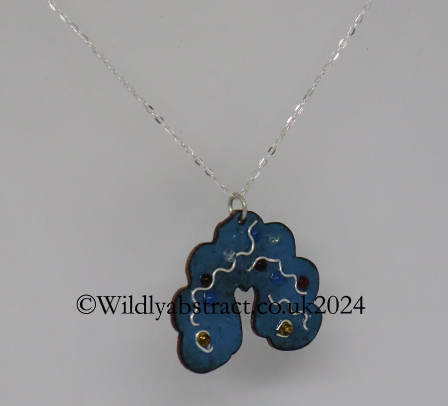 Abstract enamel pendant decorated with silver wire and seed beads