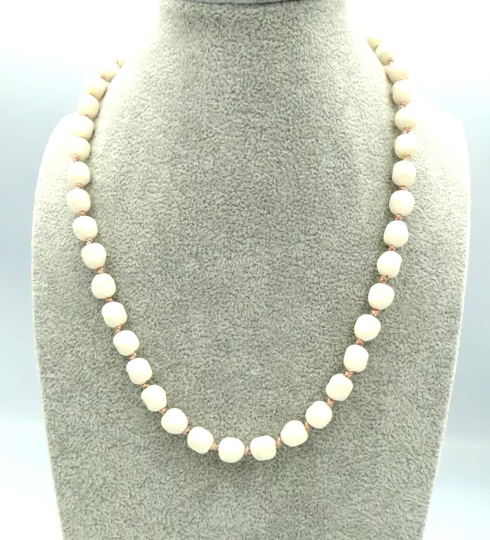 Cream glass pearl necklace  Traditionally knotted with pink silk thread 