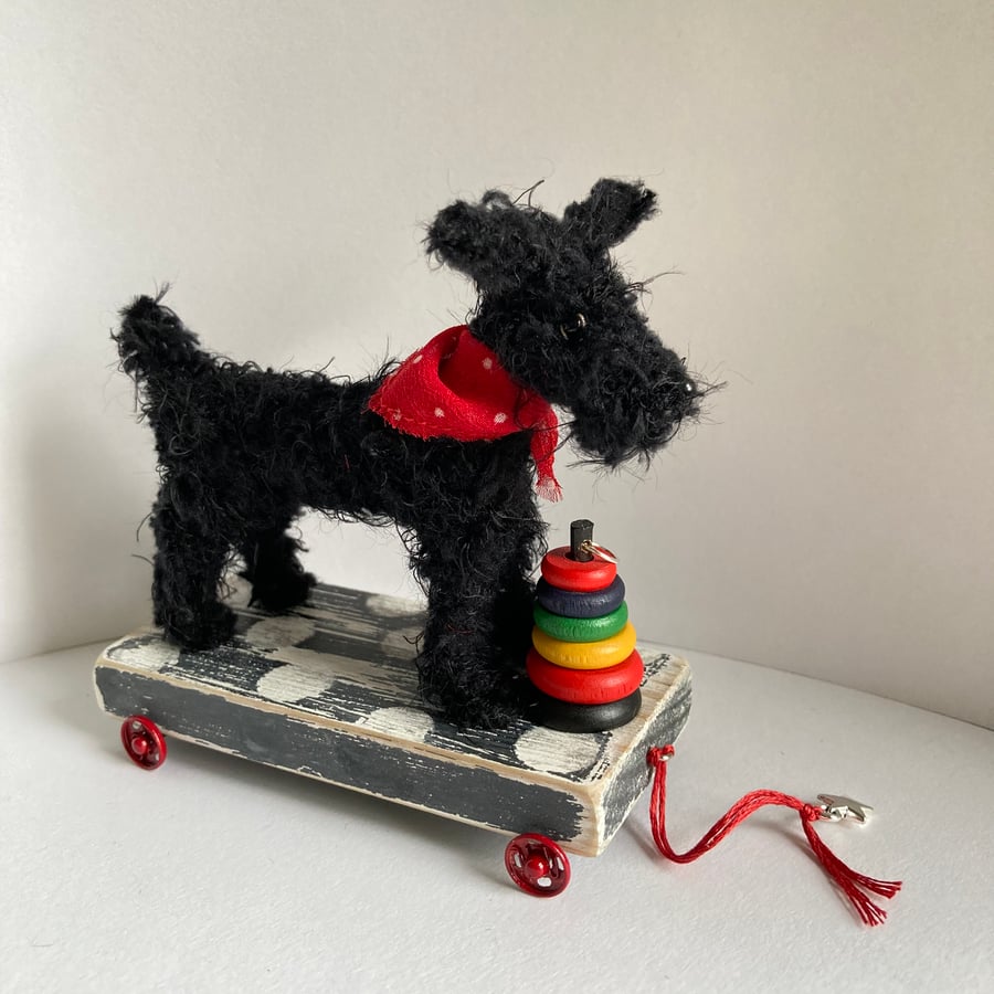 Miniature Handmade Dog on a Trolley with Wheels. 