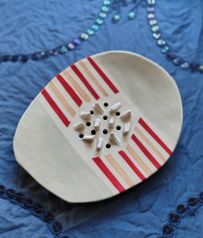 Ceramic soap dish with pastel red and peach stripes